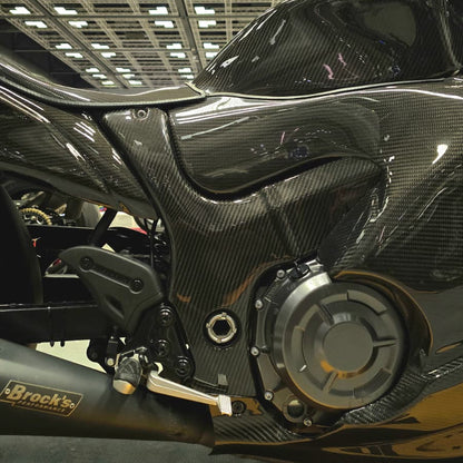 Close-up of a motorcycle engine with a blurred indoor background